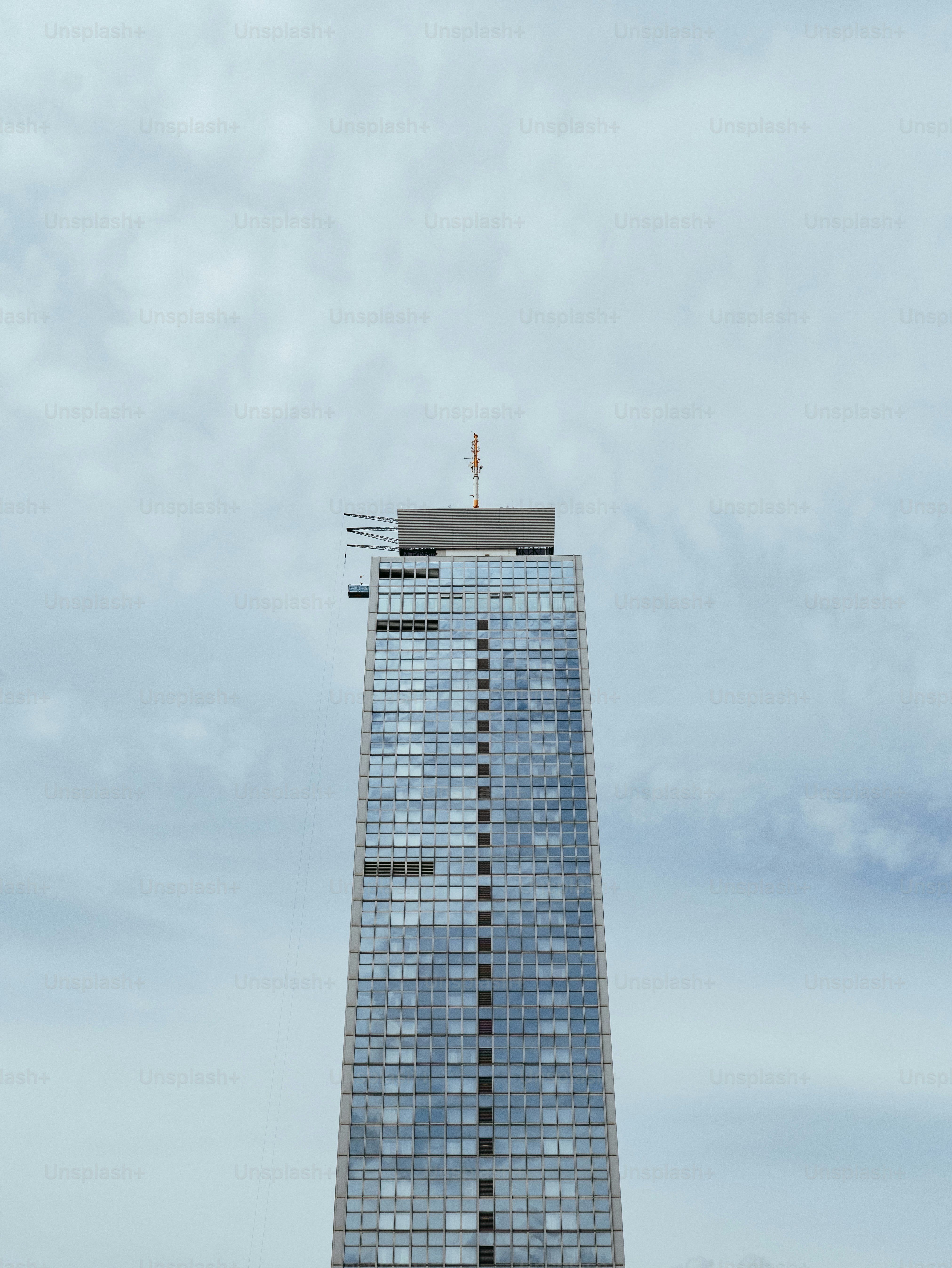 a very tall building with a sky background