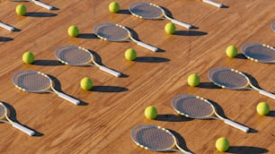 a group of tennis rackets and balls on a wooden surface