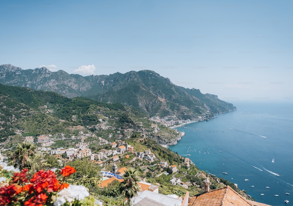 a scenic view of a town and the ocean