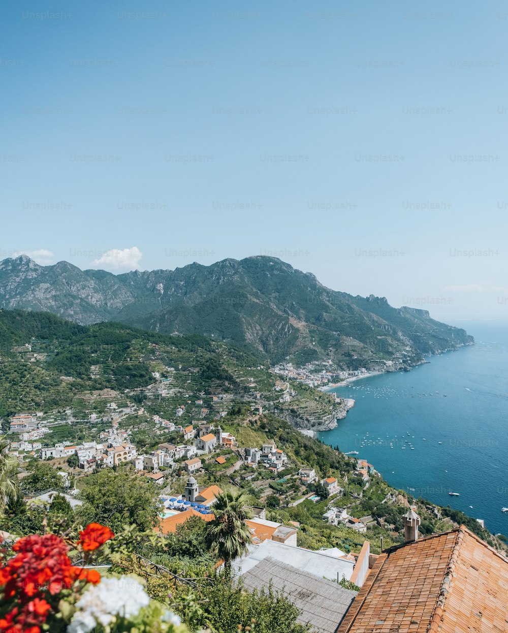 a scenic view of a town and the ocean