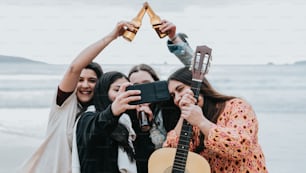 a group of women standing next to each other holding up a guitar