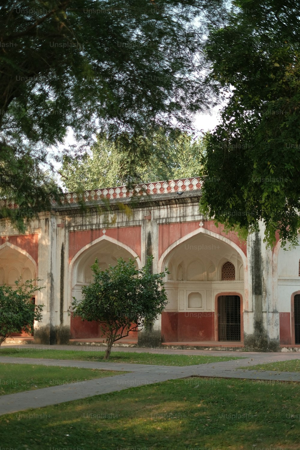 an old building with a clock on the front of it