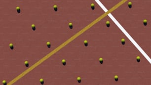 a tennis court with several tennis balls on it