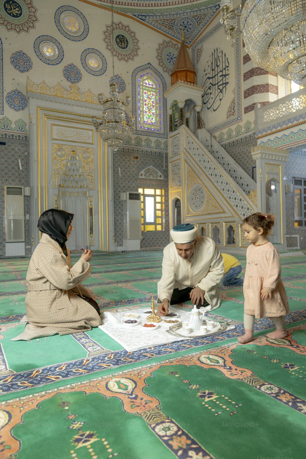 a couple of people that are sitting on a rug