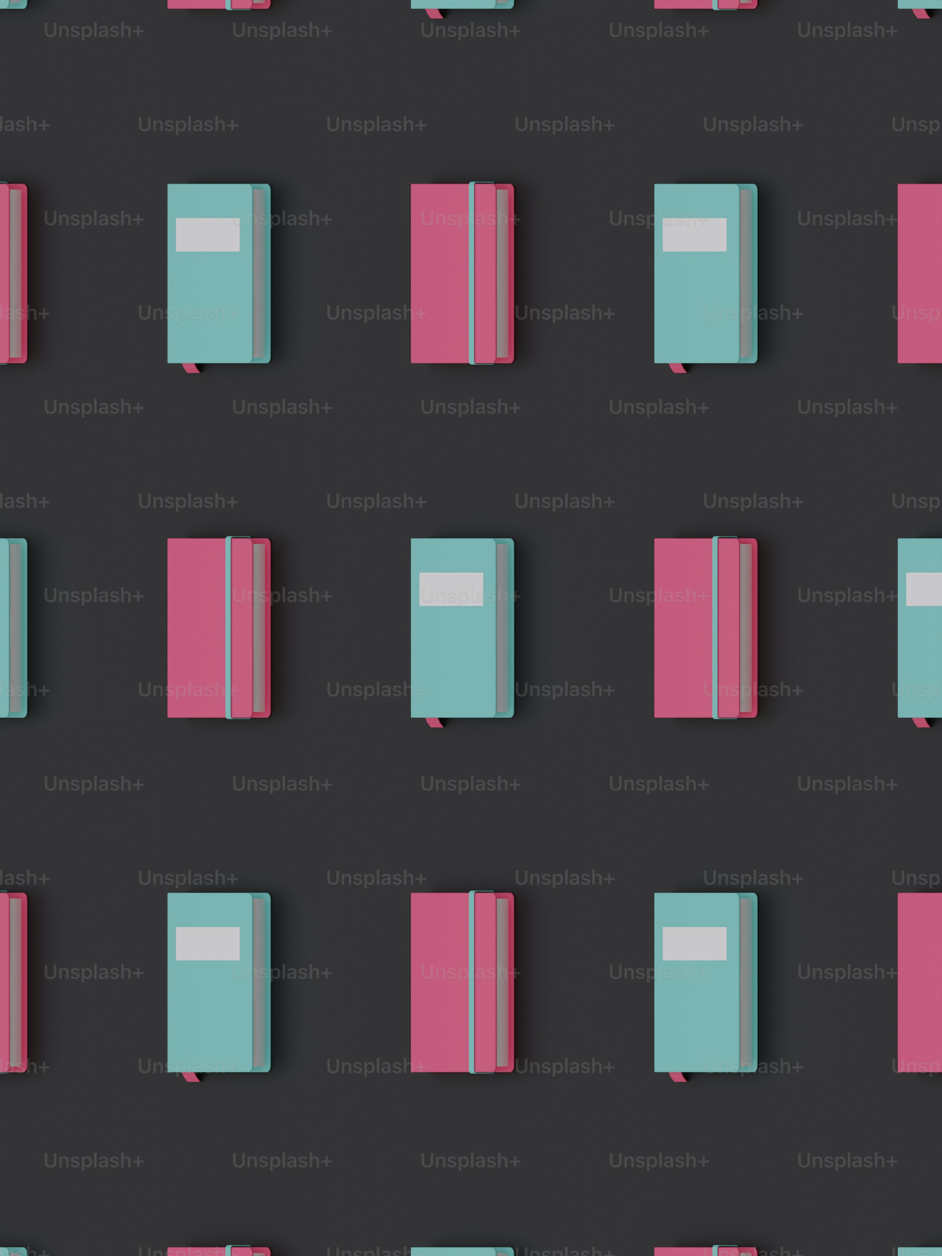 a group of pink and blue books on a black background