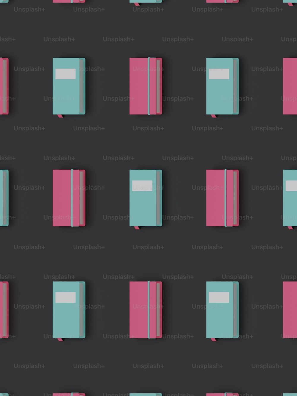 a group of pink and blue books on a black background