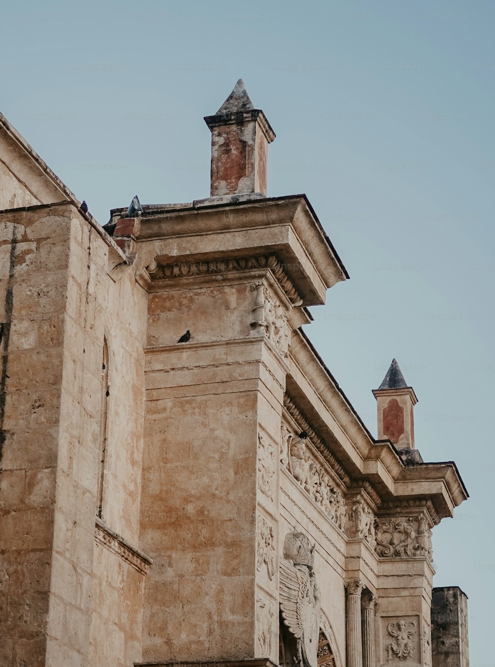 a tall building with a clock on the top of it