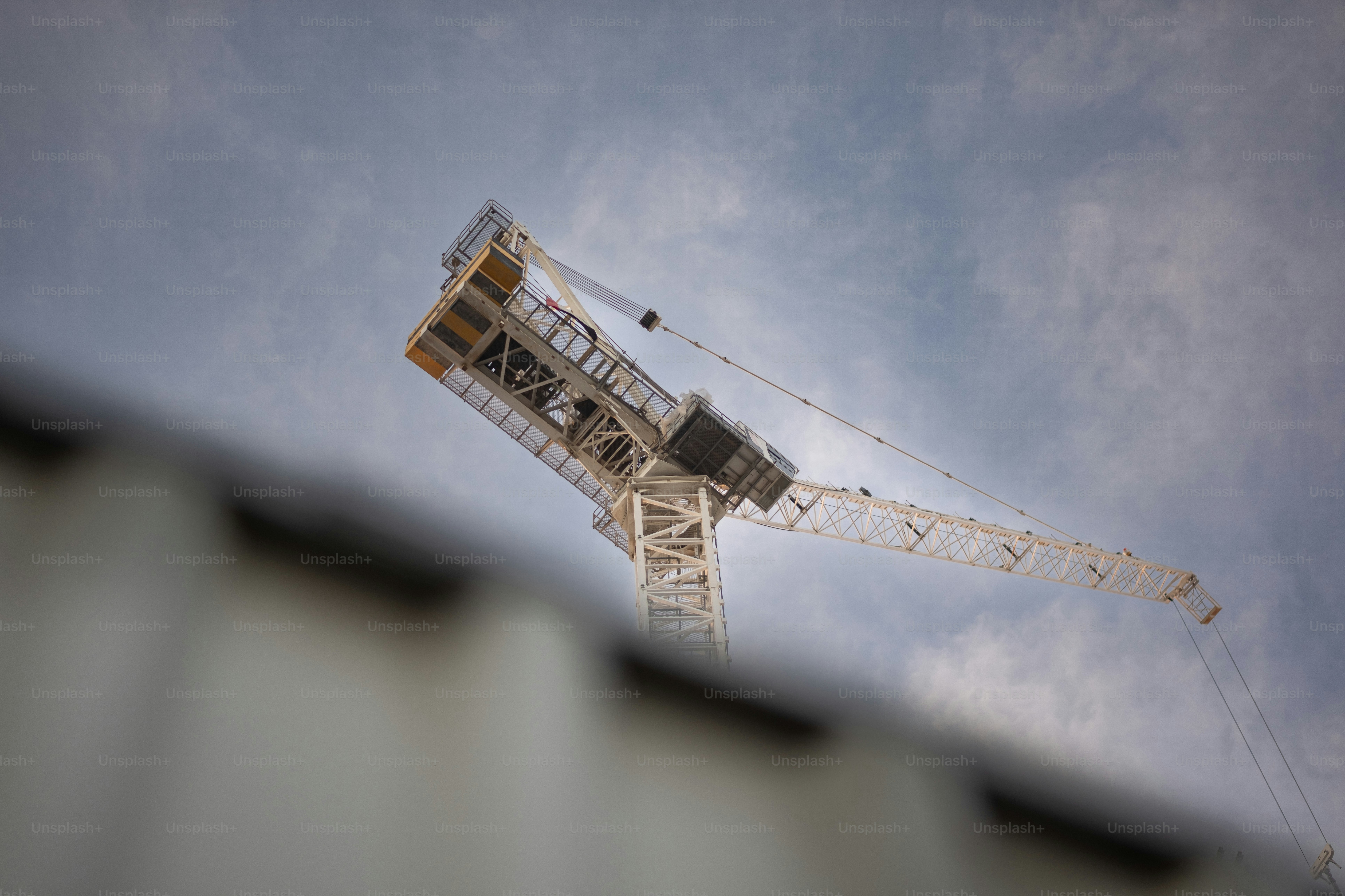 Cranes towering over new high-rise construction.