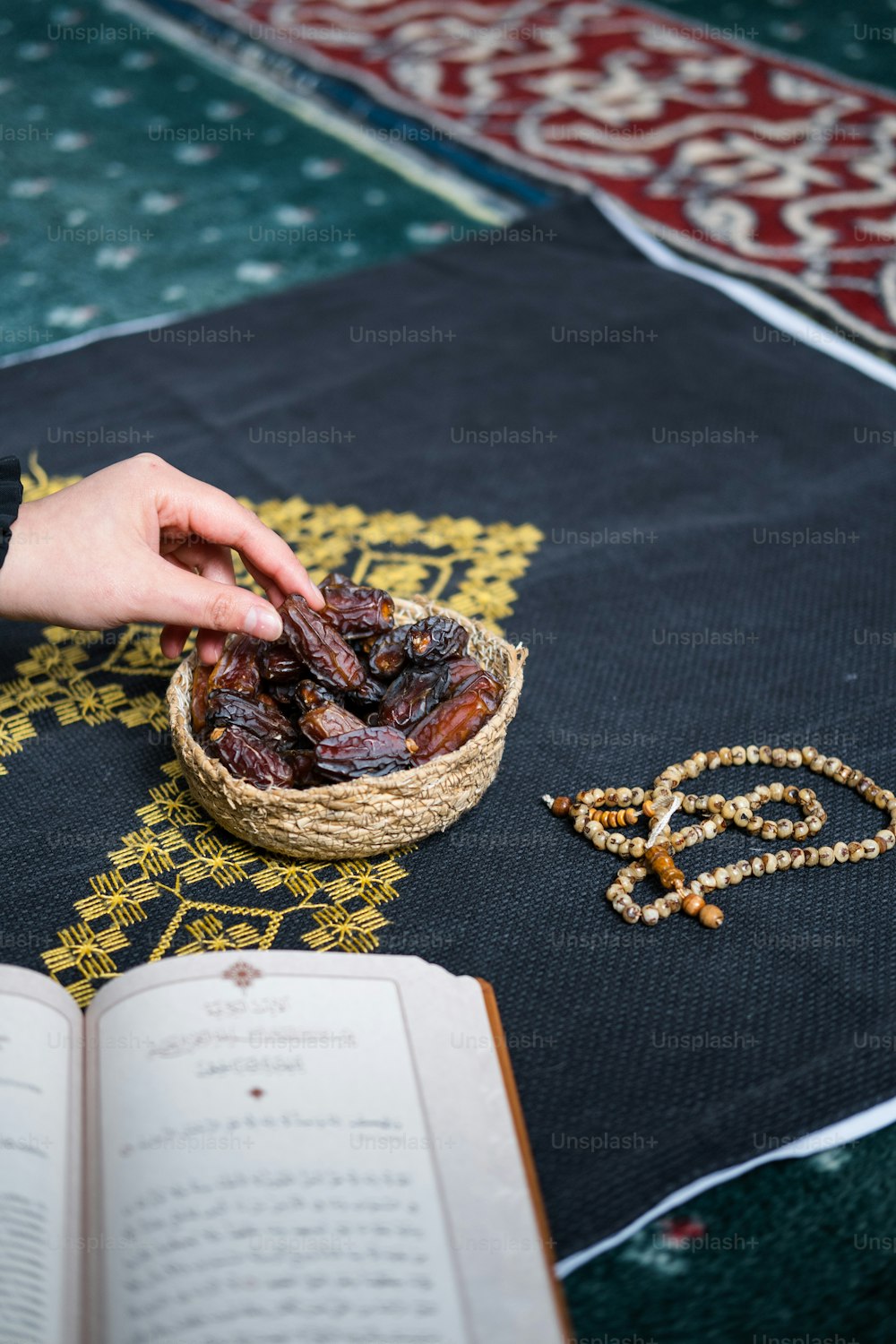 a person reaching for dates in a basket