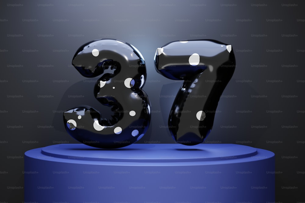 a black and white polka dot number thirty five on a blue pedestal