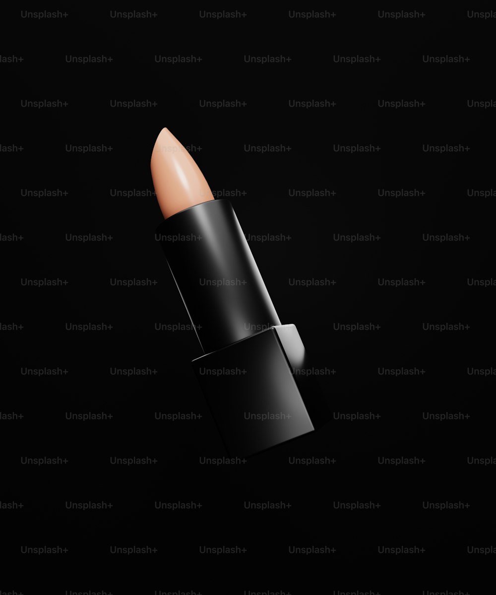 a close up of a lipstick on a black background