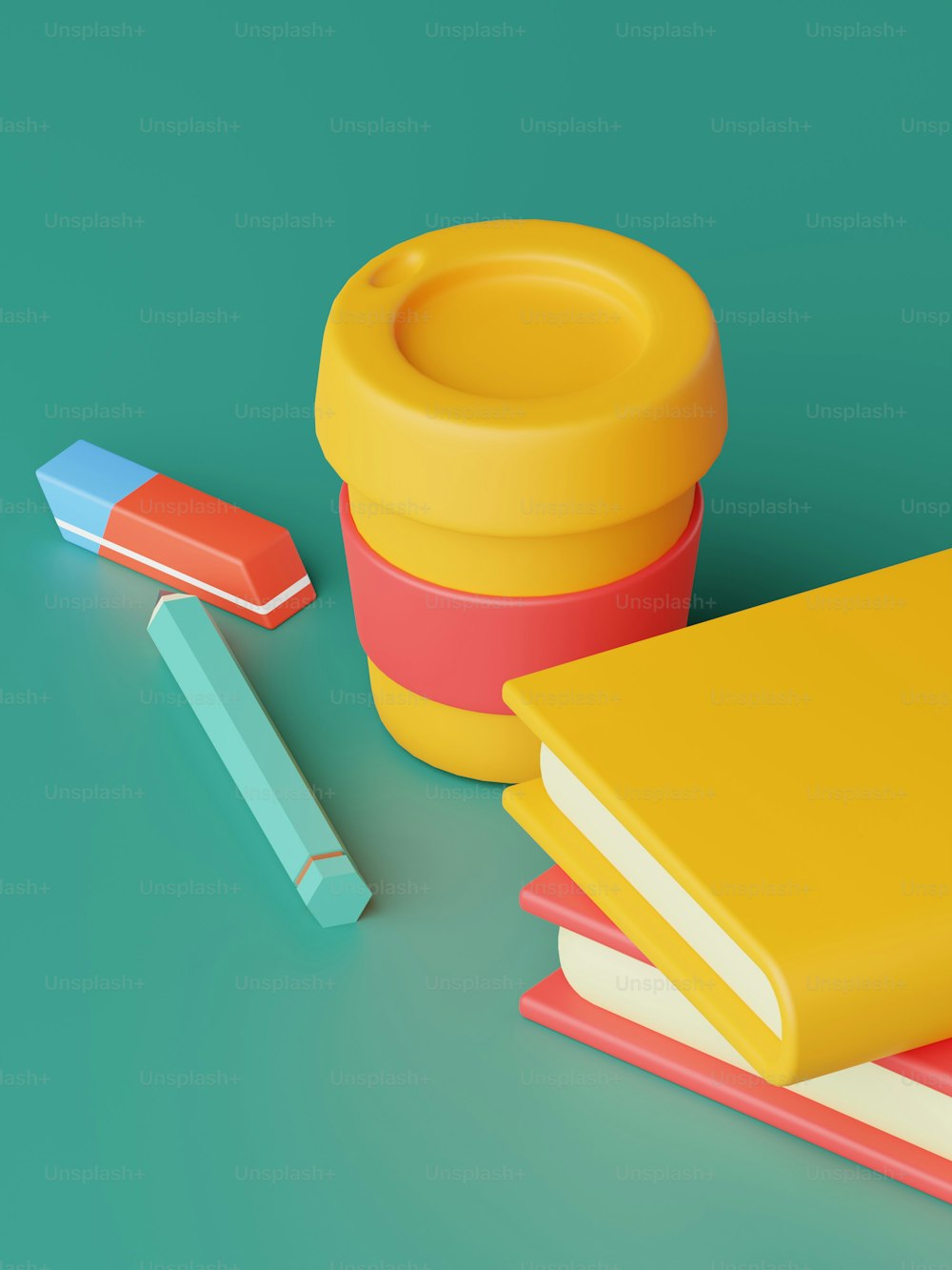 a stack of books next to a yellow cup