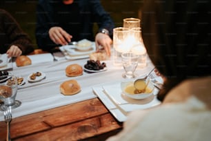 a group of people sitting around a table eating food