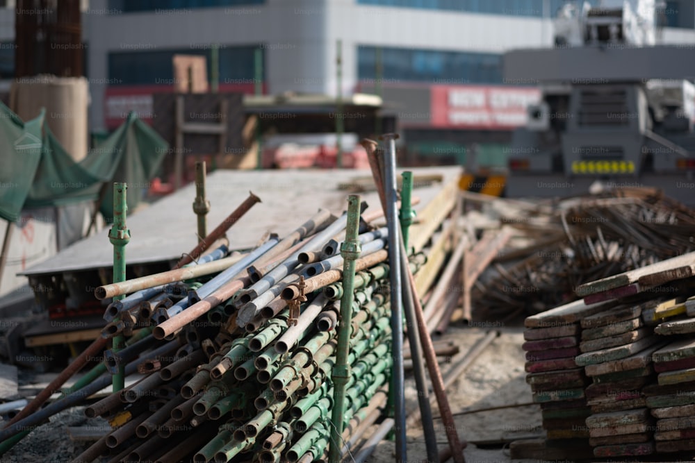 a pile of wood sitting next to a building