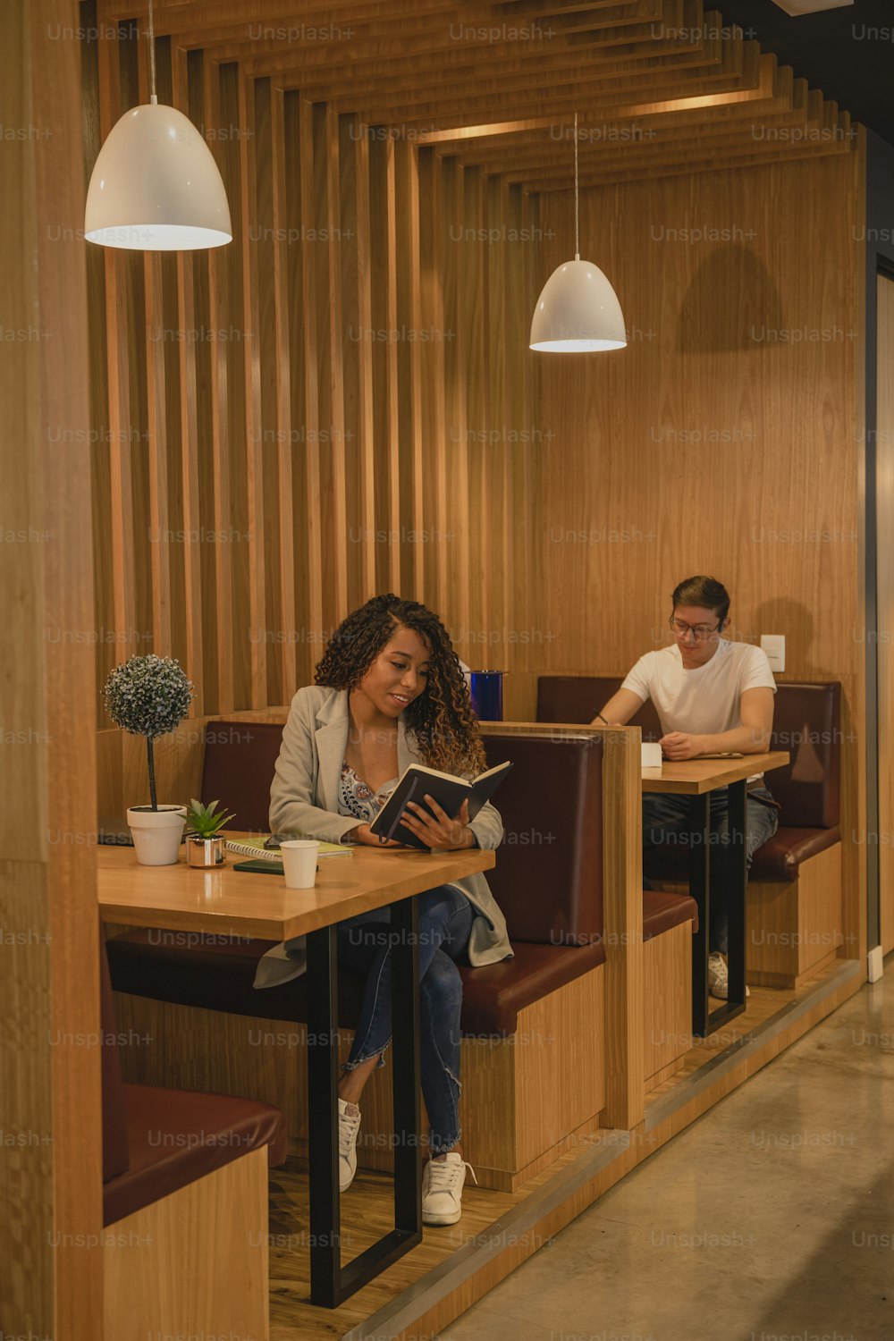 a man and a woman sitting at a table in a restaurant