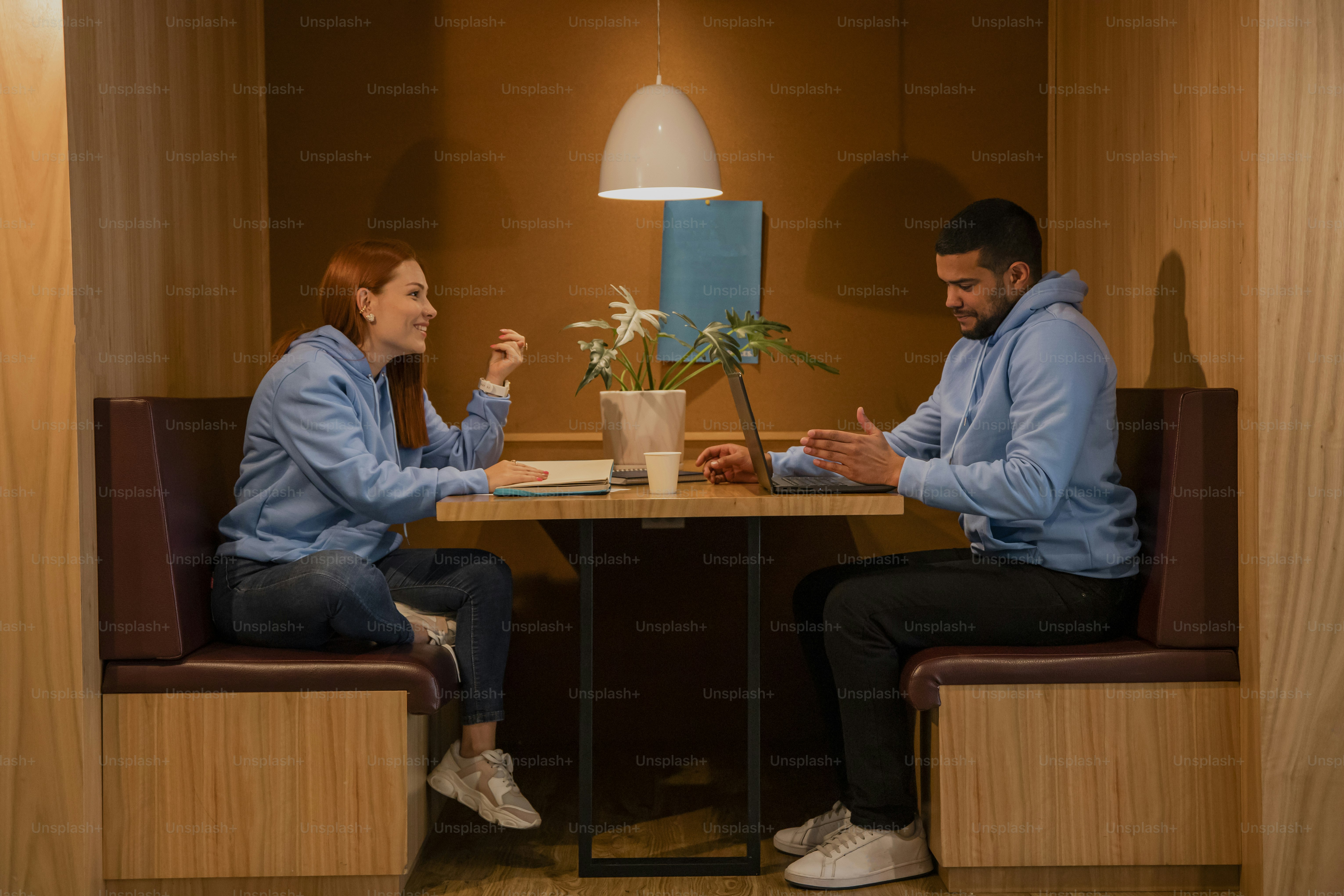 a man and a woman sitting at a table