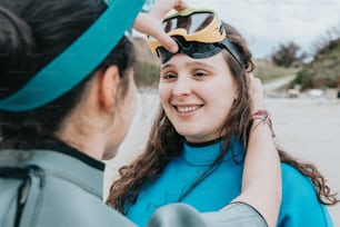 a woman wearing goggles and a blue shirt