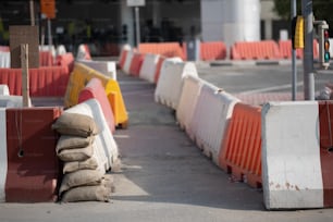 a row of orange and white barriers sitting next to each other