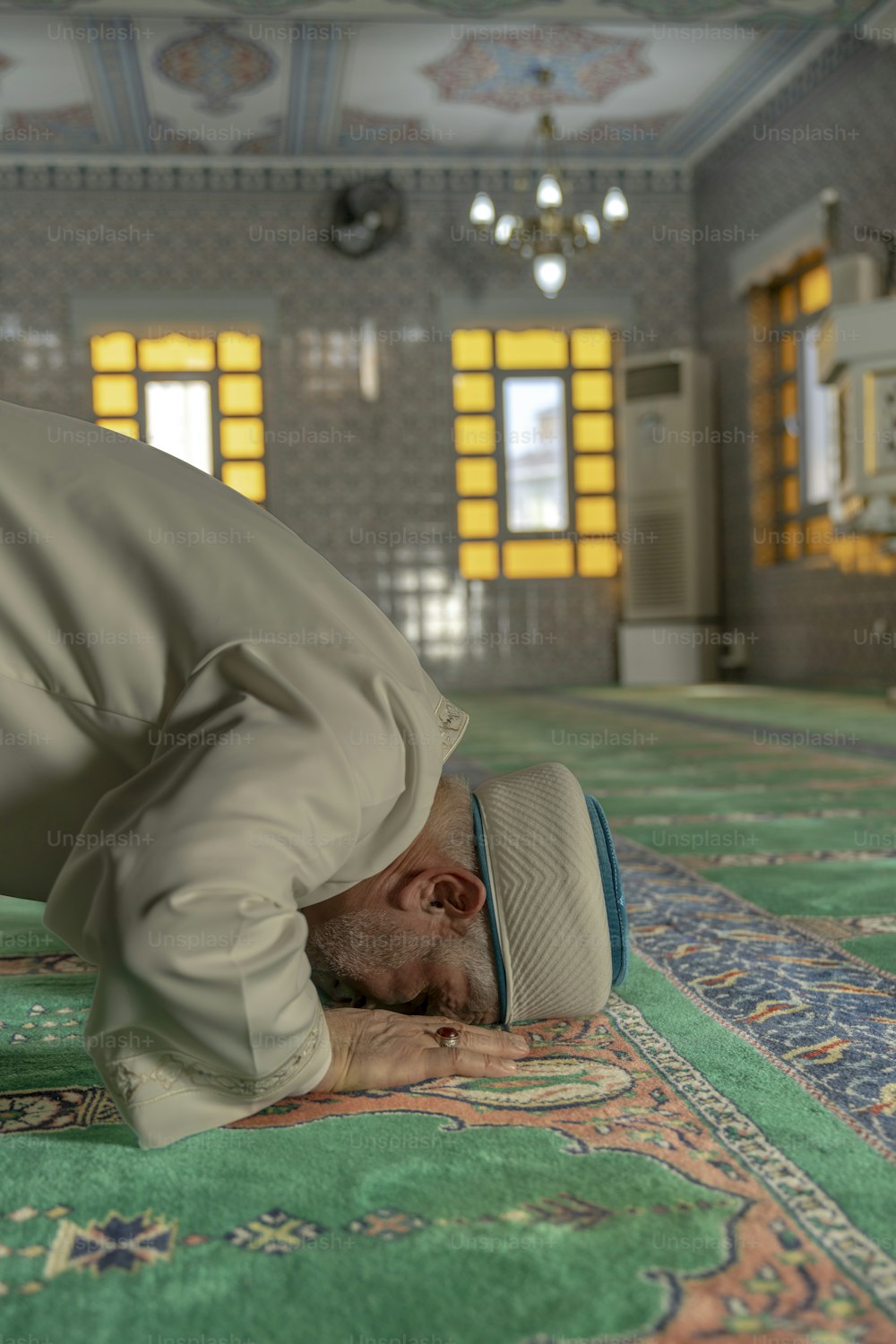 a man laying on a rug in a room