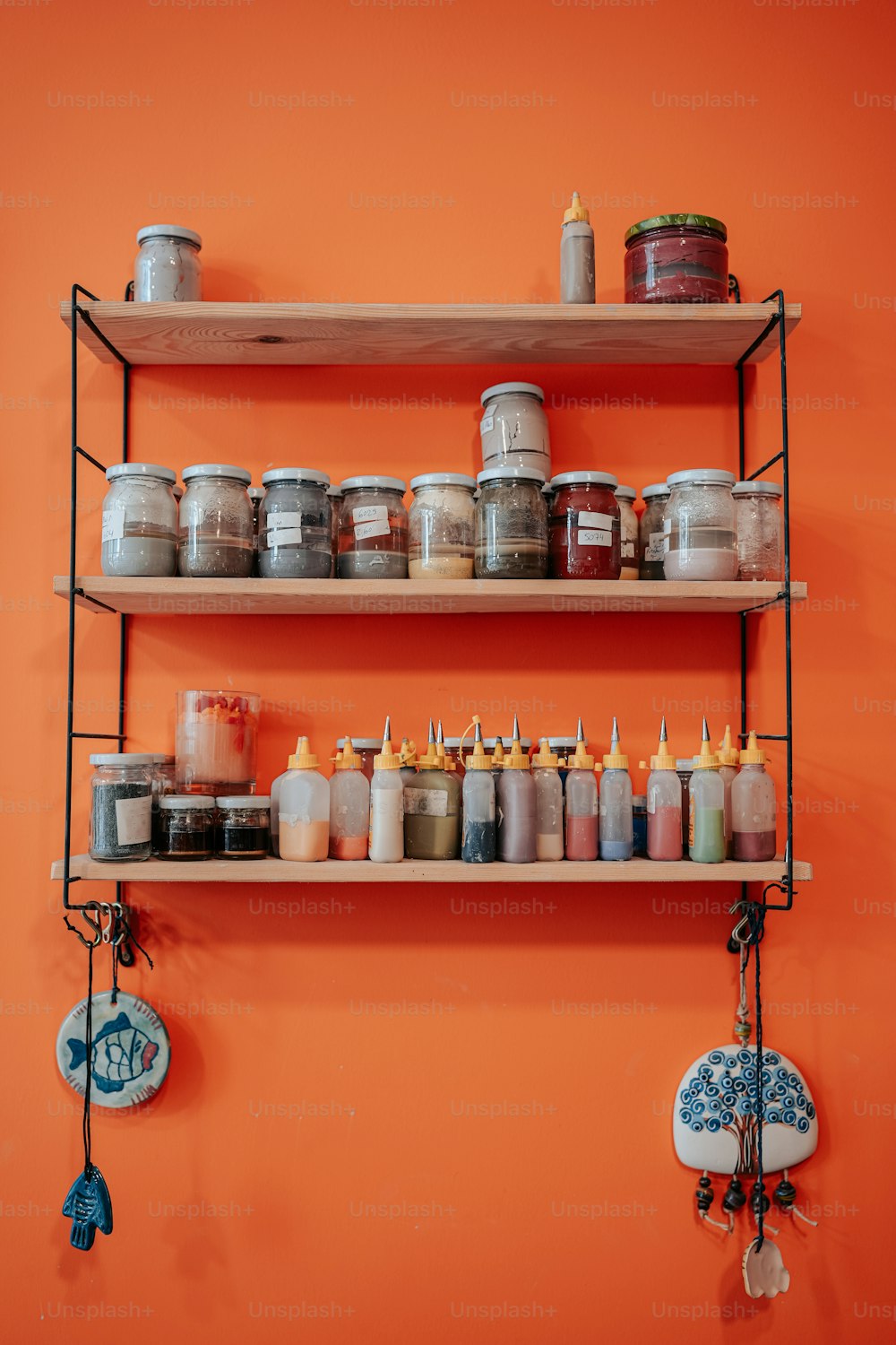 a couple of shelves that have some jars on them