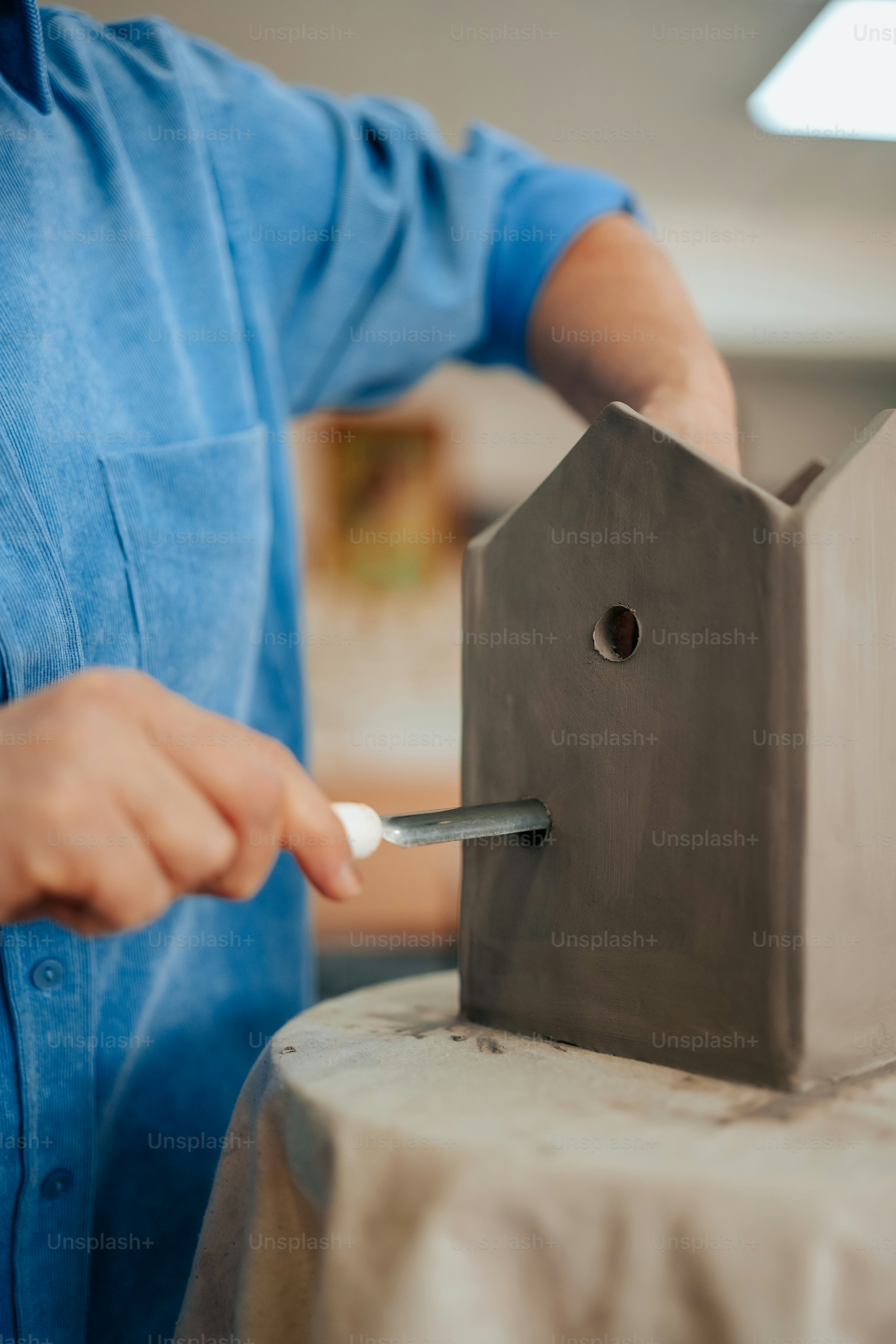 a man is putting a cigarette in a smoker