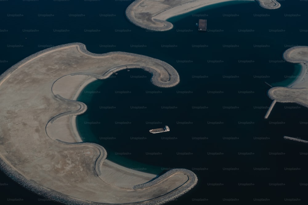 an aerial view of an island in the middle of the ocean