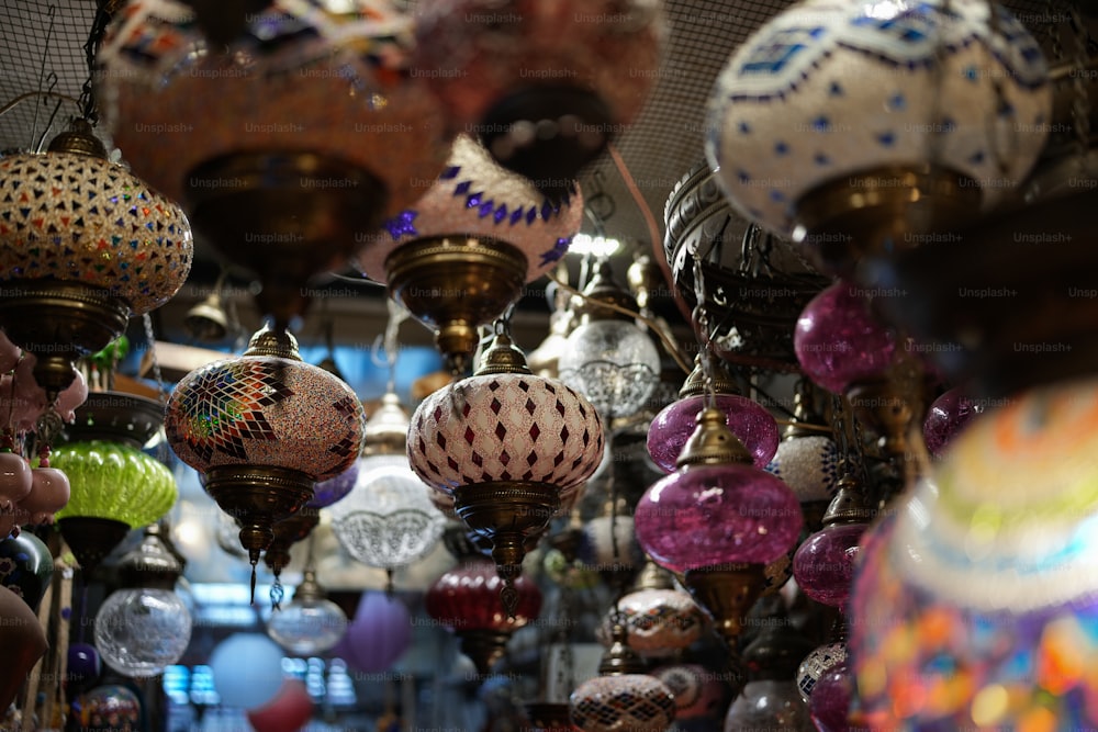 a store filled with lots of different colored lamps