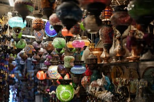 a store filled with lots of different colored vases