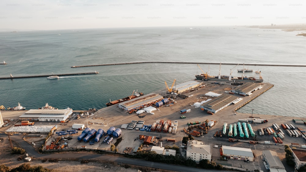 a large body of water with a dock and a lot of vehicles