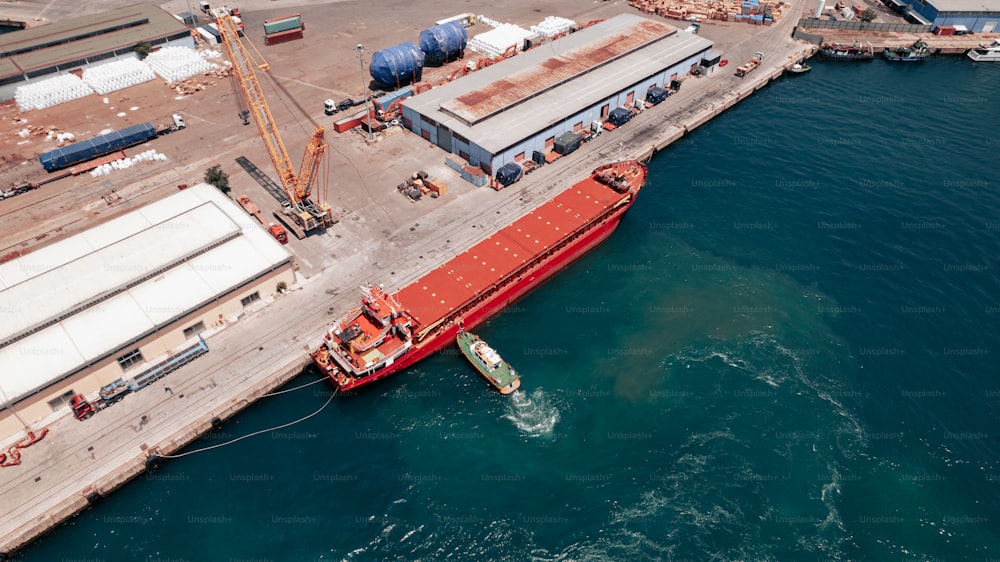 a large red boat in a body of water