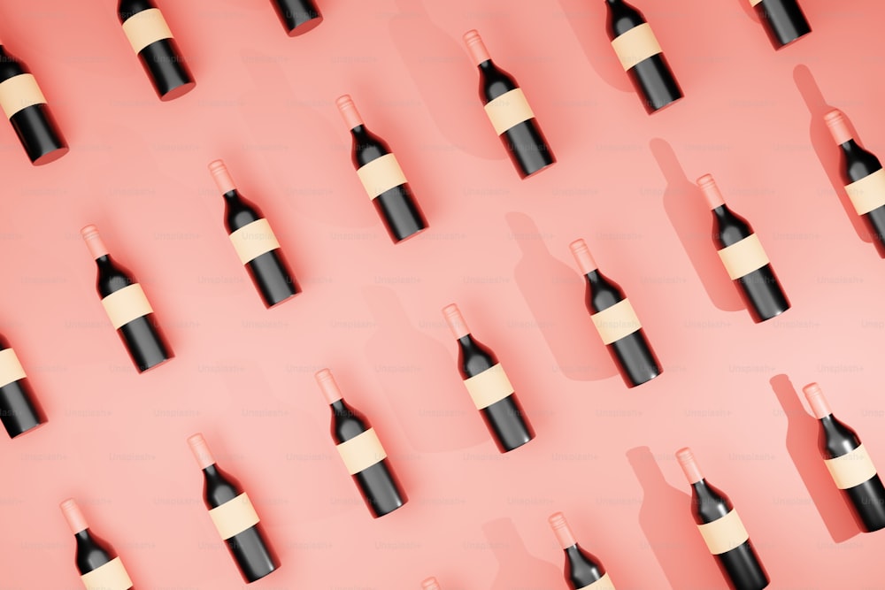 Un grupo de botellas de vino sobre un fondo rosado