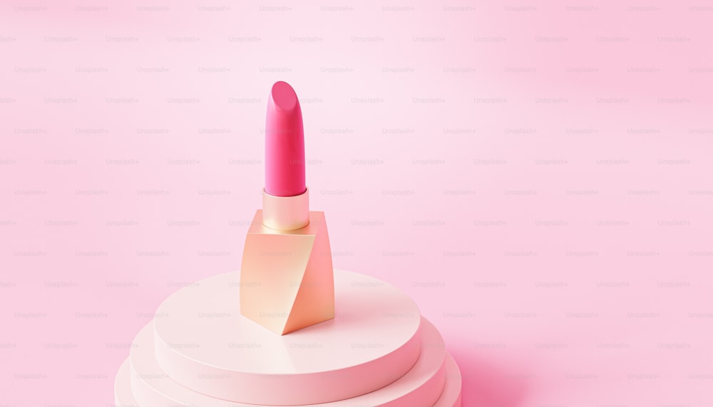 a pink lipstick sitting on top of a stack of white boxes
