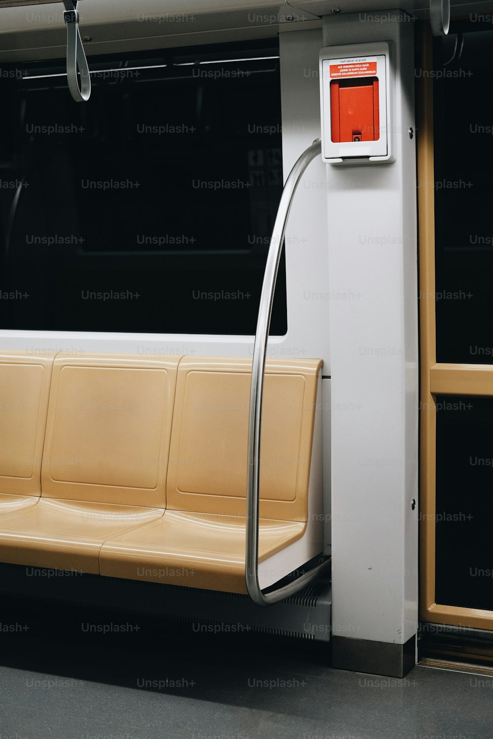 a yellow and white bench sitting next to a window