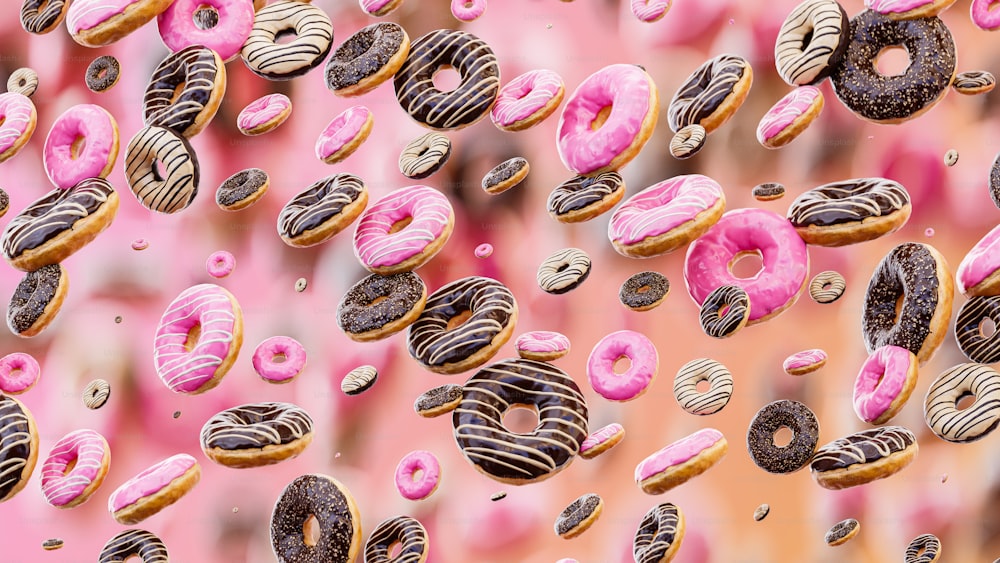 Un grupo de donuts con glaseado rosa y chispas