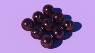 a bunch of shiny purple balls on a purple background