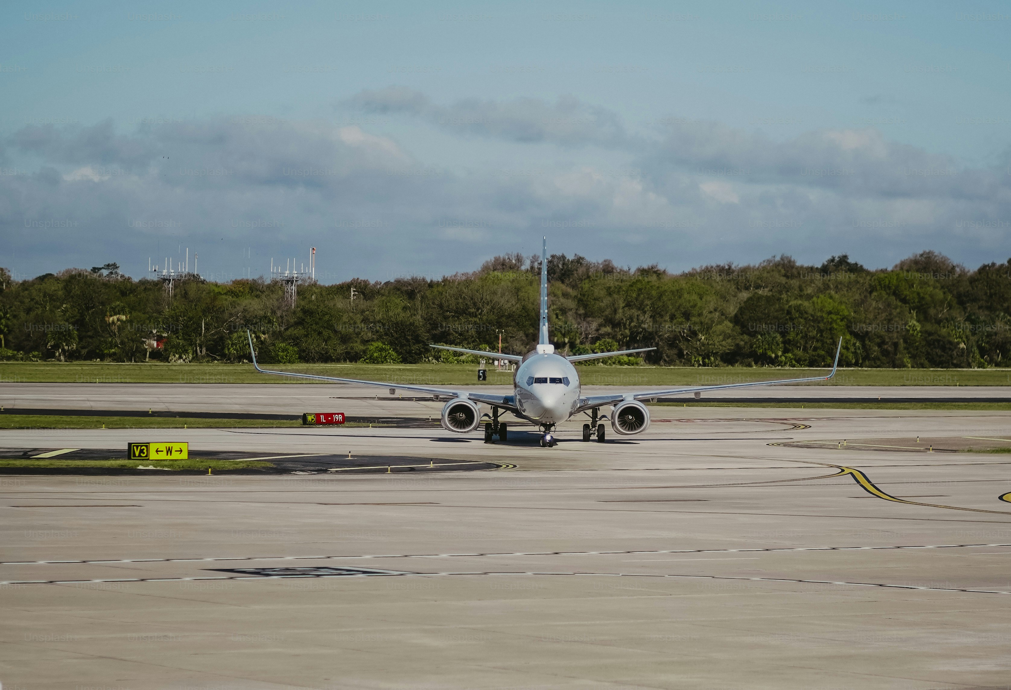 a large jetliner sitting on top of an airport tarmac