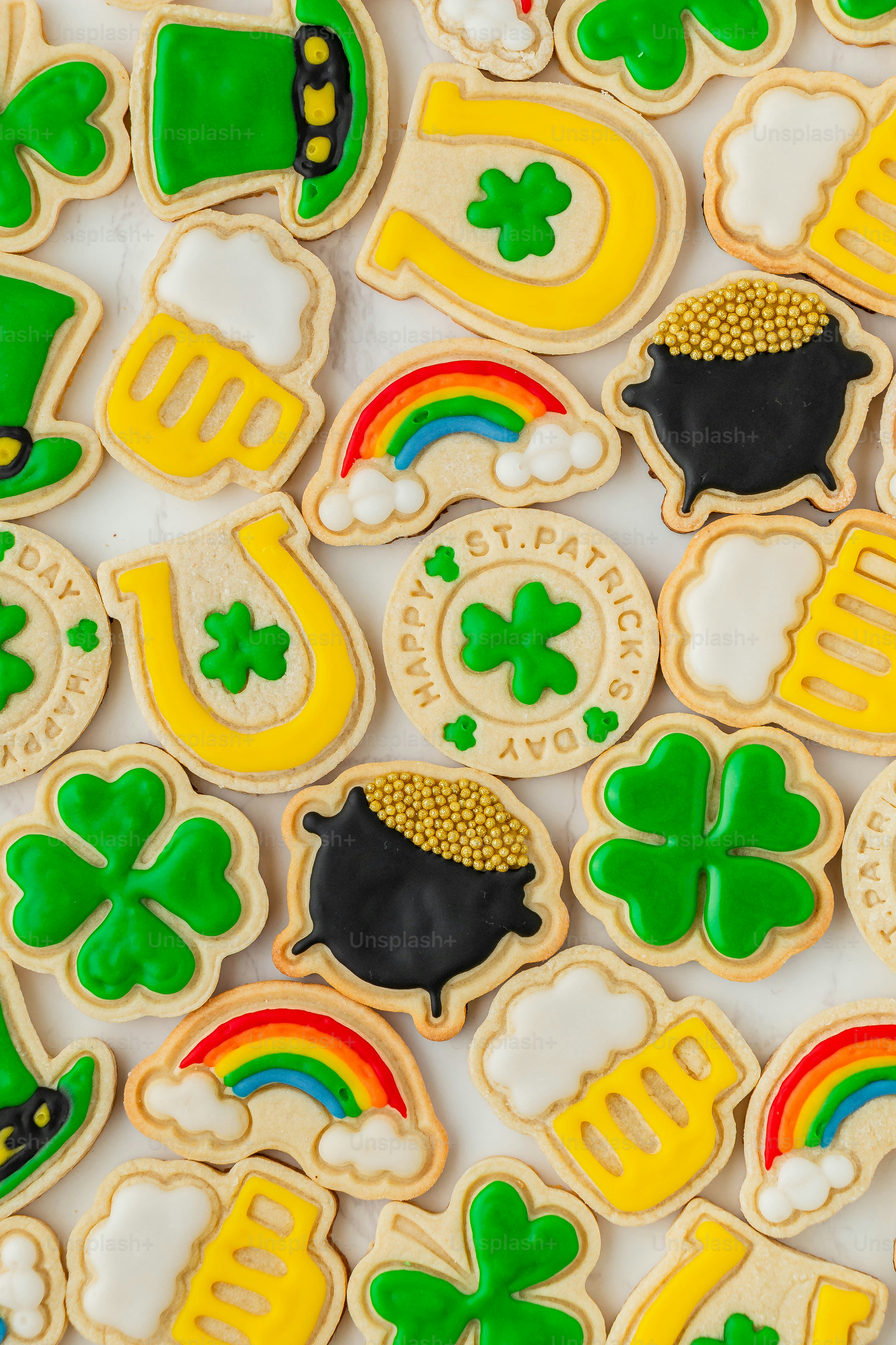 a table topped with lots of decorated cookies