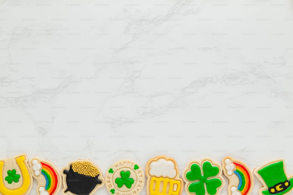 a number of decorated cookies on a table