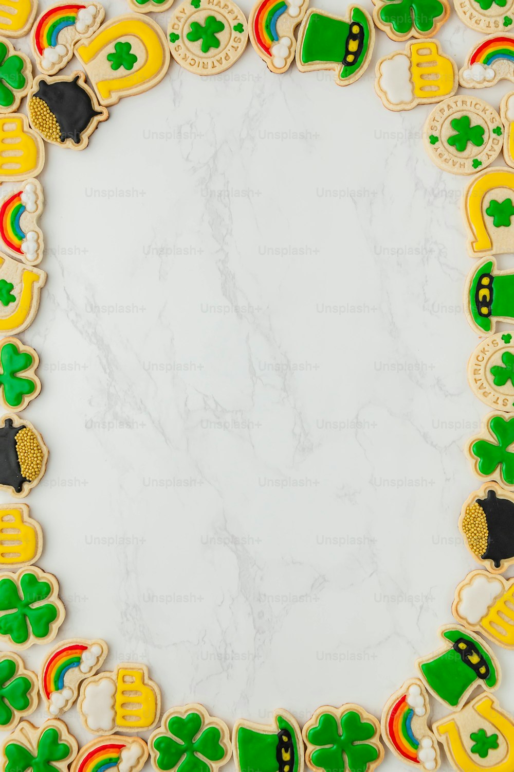 a picture frame made out of cookies with shamrocks and hats