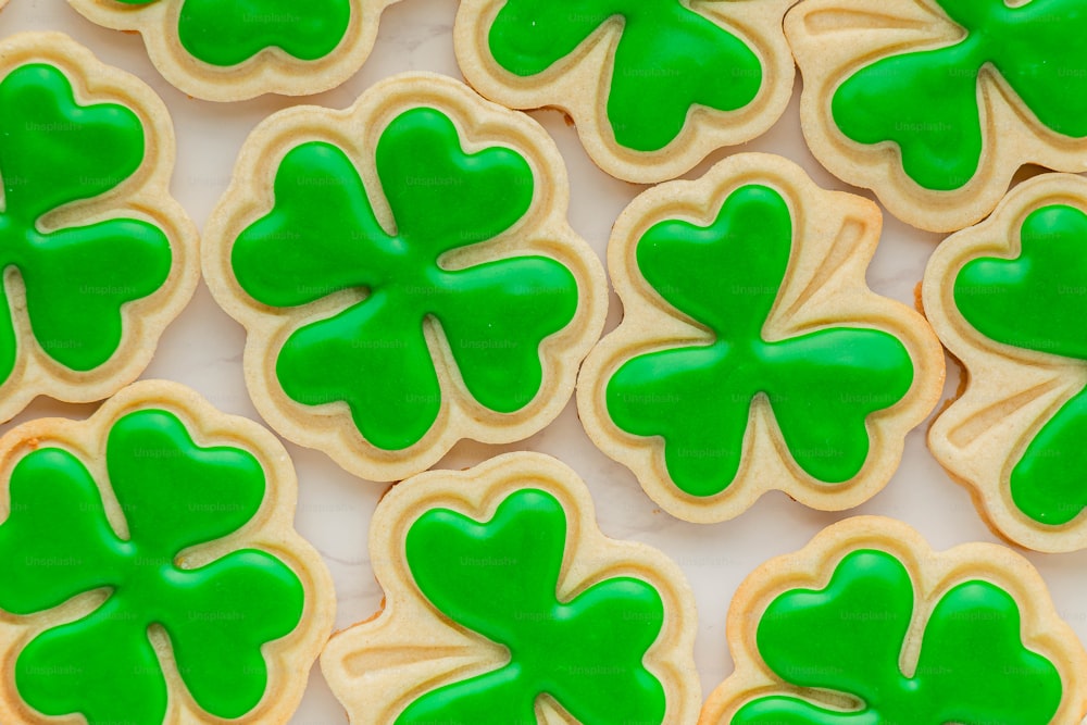 a close up of some cookies with green icing