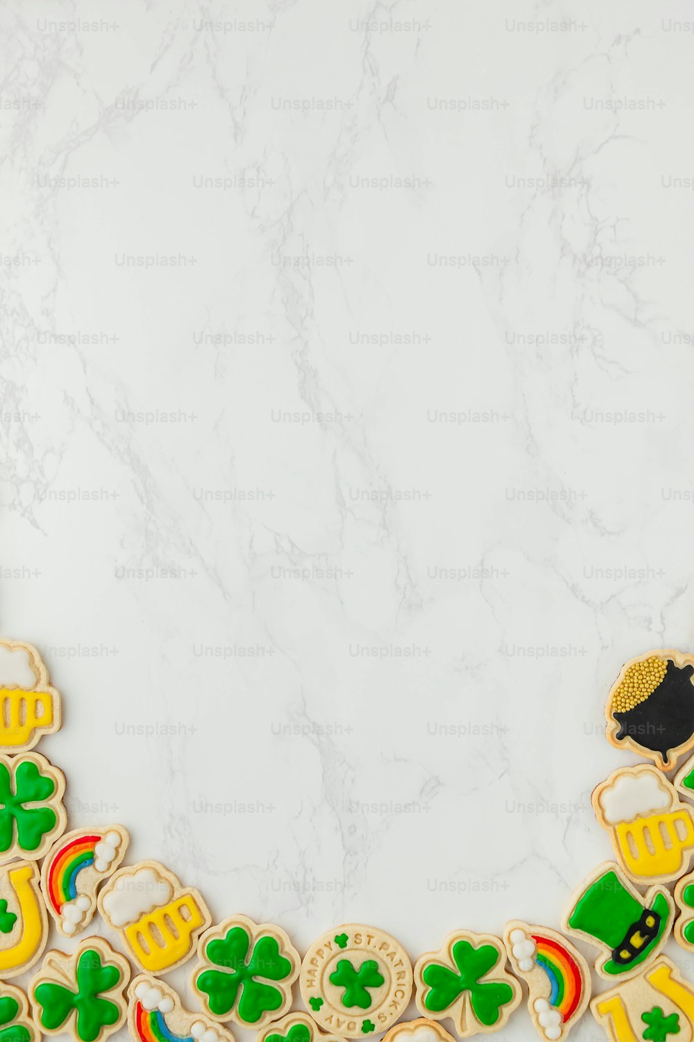 a white marble background with a decorative border made of cookies