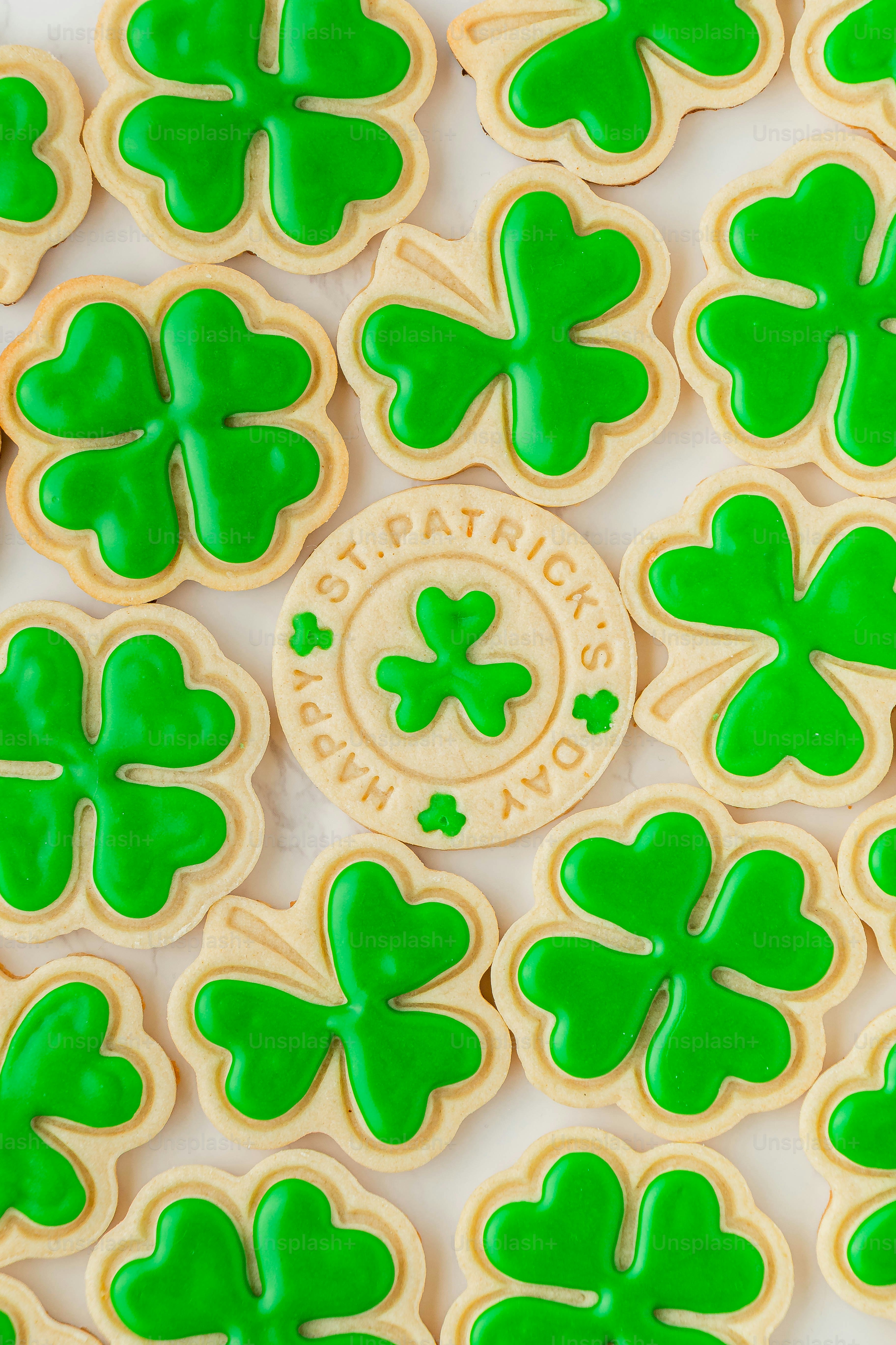 a close up of a plate of shamrock cookies