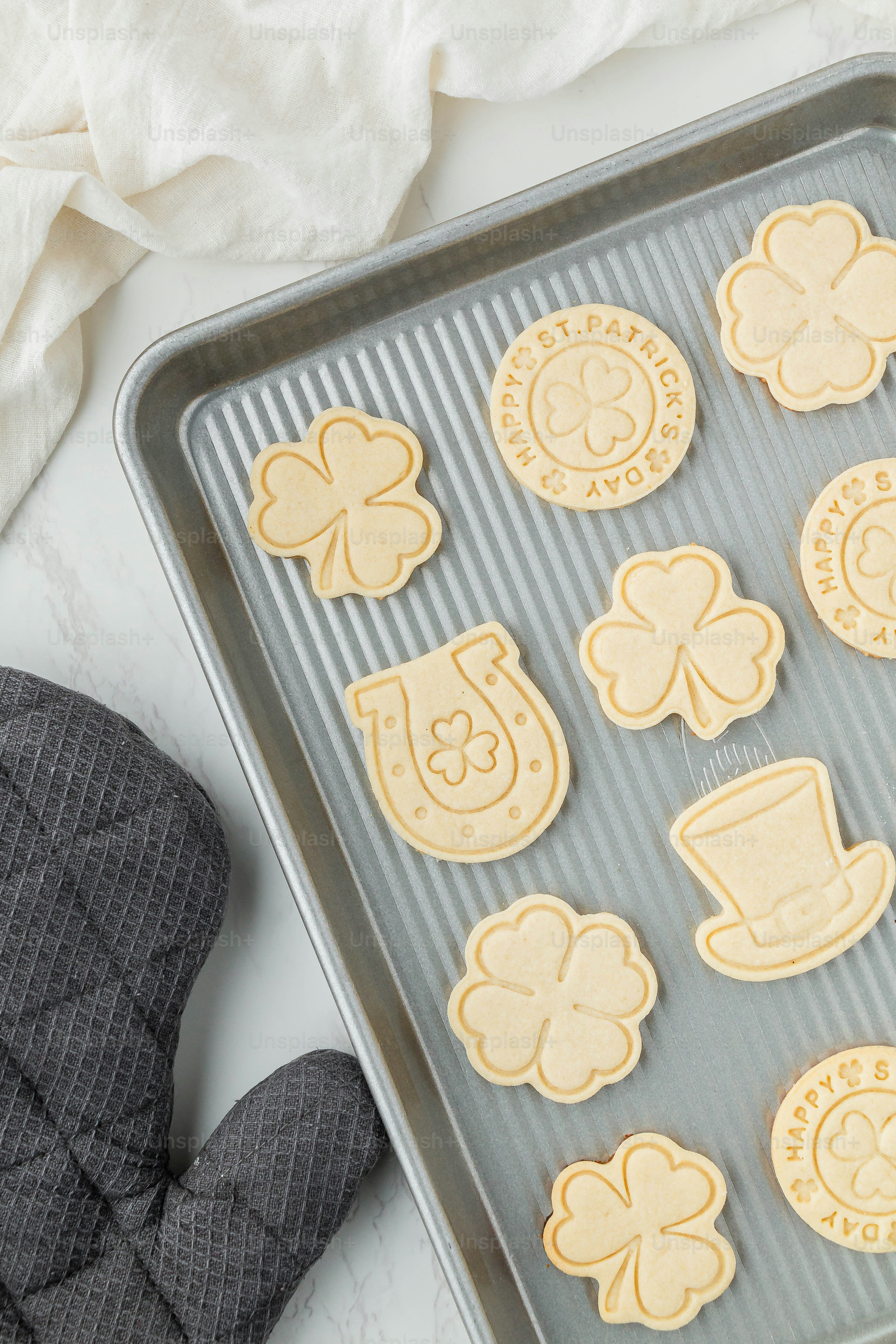 a cookie sheet with cut out cookies on it