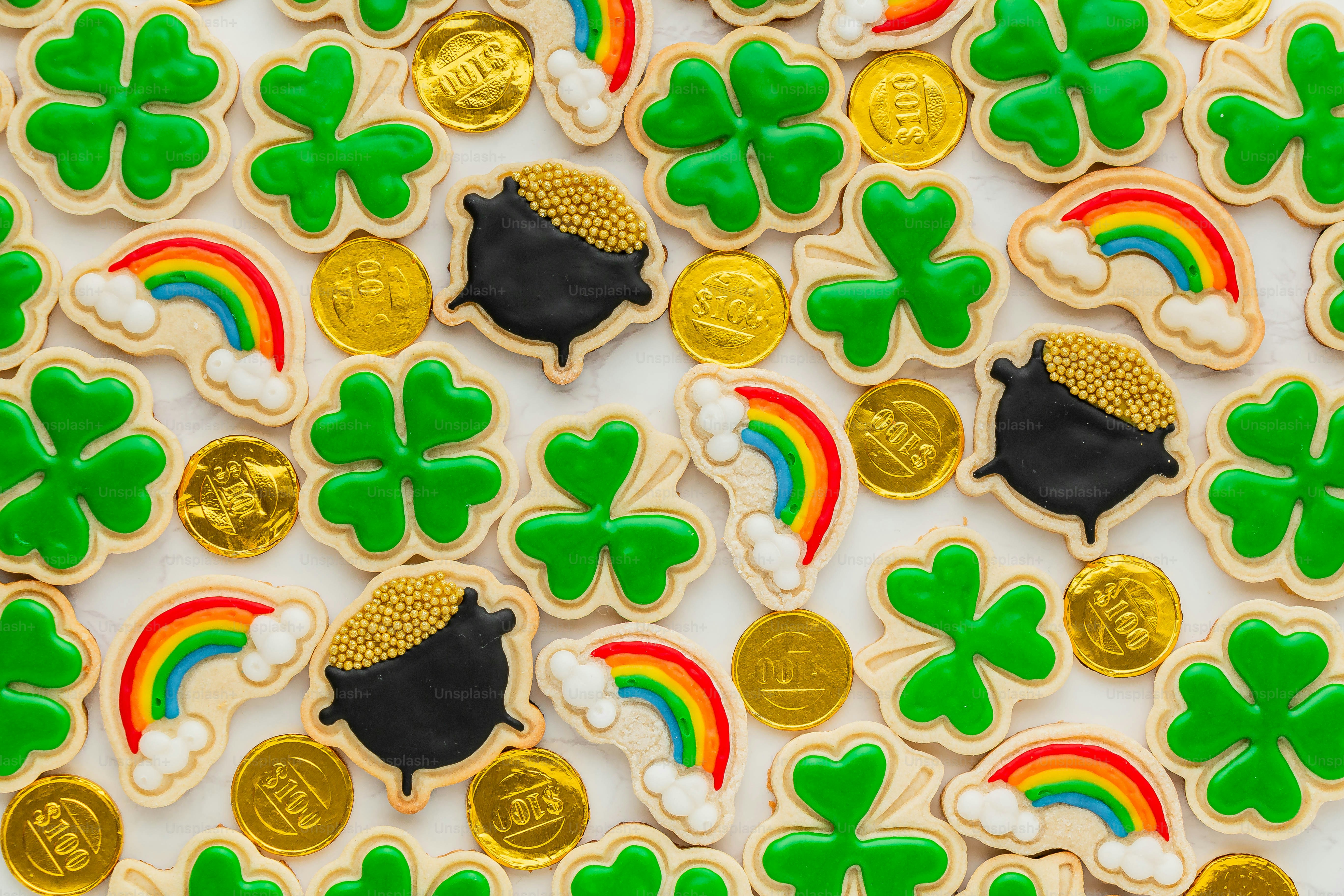 a table topped with lots of decorated cookies