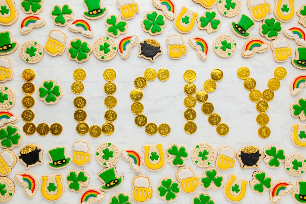 a table topped with lots of decorated cookies