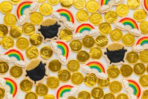 a table topped with lots of gold coins