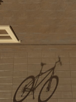 a shadow of a bicycle on a tile floor