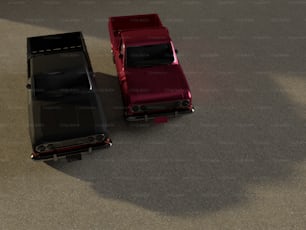 Un coche rojo y otro negro en el suelo