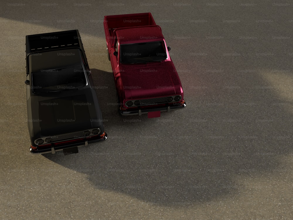 Une voiture rouge et une voiture noire au sol