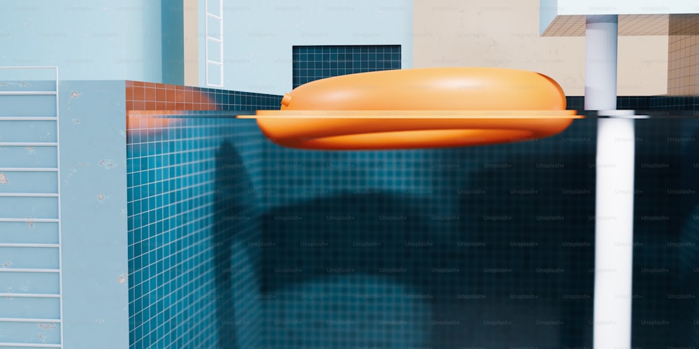 an orange object floating in a blue tiled bathroom